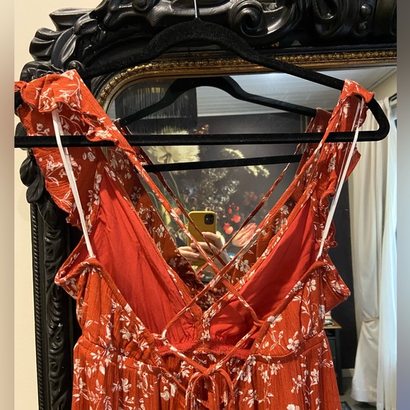 Burnt orange floral romper with ruffles and crisscross back (adjustable) - Picture 6 of 7